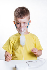 small child treats bronchitis inhaler at home