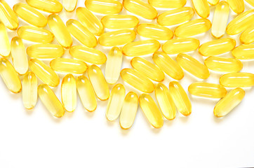 Omega 3 fish oil capsules on white background. Concept of healthcare. Top view, flat lay, copy space.