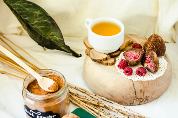 Homemade Healthy Paleo Raw Chocolate Truffles with fresh berries Nuts, Dates and Marzipan.