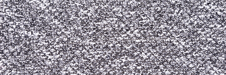 Gray wool background with patterns. Grey woolen fabric texture