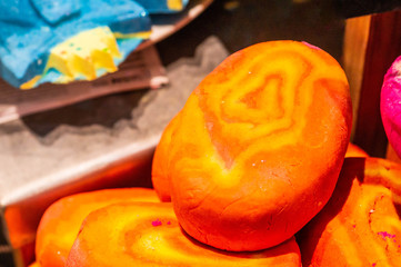 Shop cosmetic handmade bombs and bubble bath different colors. The concept of Spa and relaxation