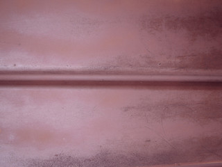 Old profiled metal sheet for background. The edge is horizontal. Coating vintage paint with scratches.