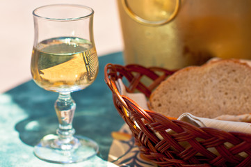 glass of white wine, bottle socket and bread