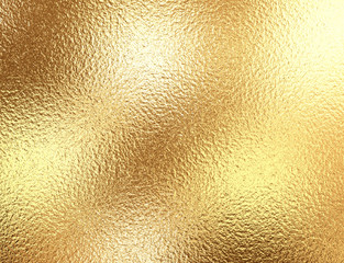 Gold foil background with light reflections