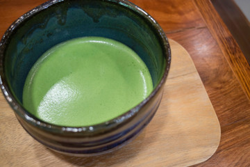 Bowl of hot matcha green tea drink