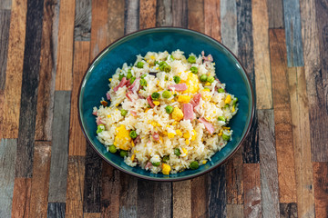 Homemade Chinese fried rice with vegetables and fried eggs