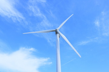 wind turbine on background of blue sky	