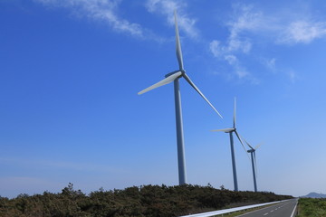 wind turbines on background of blue sky