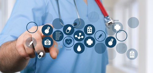 Medical icons and young  doctor with stethoscope