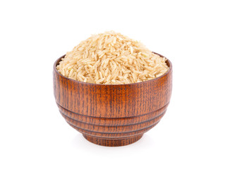 uncooked organic brown jasmine rice in wooden bolw on white background