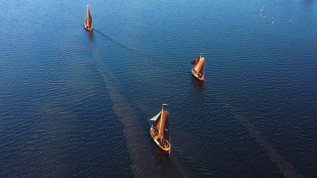 Aerial of typical Dutch blunter ships in a contest nearby village Spakenburg, The Netherlands