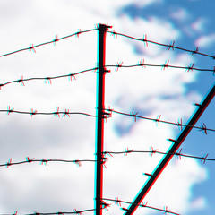 Barbed wire on country border. Barbwire on fence for prohibition of illegal aliens crossing. Glitch...