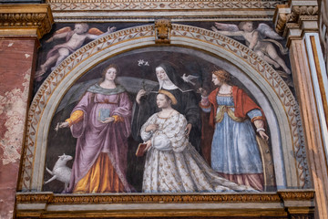 Italy, 03/28/2019: the interior of San Maurizio al Monastero Maggiore, 1518 church known as the Sistine Chapel of Milan, details of the chapels in the faithful's area with frescoes by Aurelio Luini