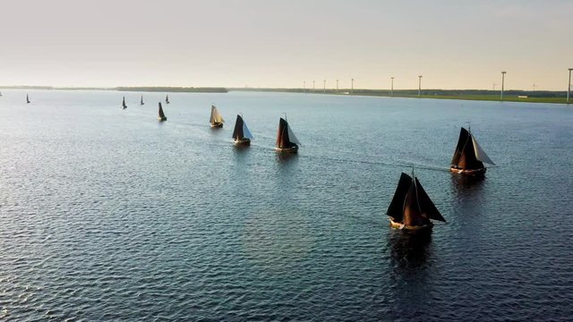 Aerial of typical Dutch blunter ships in a contest nearby village Spakenburg, The Netherlands