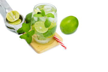 mojito cocktail with lime and mint in glass for hot summer days and good for health isolated white copy space