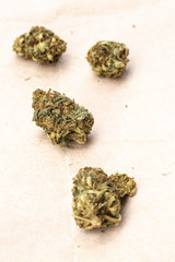 Fototapeta na wymiar Legal Marijuana flowers on paper background