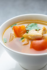 Hot soup chicken healthy at morning on concrete table.