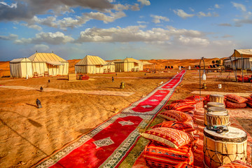 Camping site with tents in the Sahara Desert in Morocco - obrazy, fototapety, plakaty