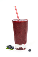 Glass of fresh cool blueberry sorbet from fresh blueberries on white background