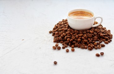 Cup of espresso and coffee beans