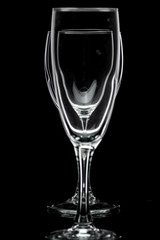 Wine glass with red wine or empty on black background