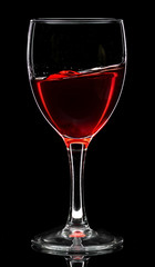 Wine glass with red wine or empty on black background
