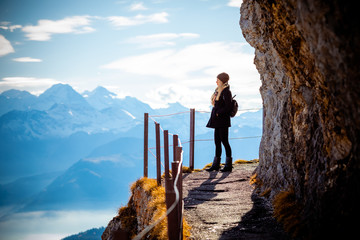 Travel mountains holiday photo - Girl with backpack walking and hiking on Alps