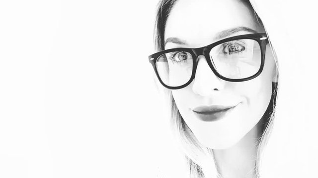 Beautiful woman with glasses smiling, Change of emotions. Black and white sketch.Fast motion. Time lapse.