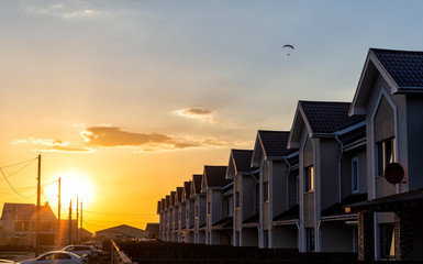Fototapeta na wymiar row of houses at sunset.