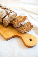 Sliced brown bread on the cutting board