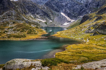Fototapeta na wymiar The landscape of part a beautiful mountain lake in the Rila mountain