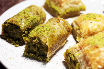 Middle eastern or arabic dishes. Turkish Dessert Baklava with pistachio on dishes