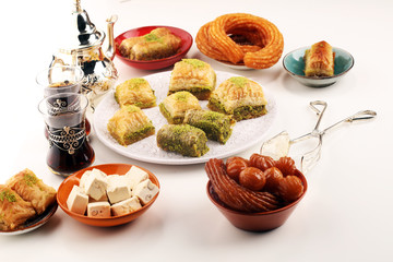 Middle eastern or arabic dishes. Turkish Dessert Baklava with pistachio on dishes