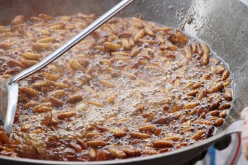 Fried silk worms is delicious in pan