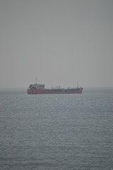 Fototapeta premium April 15, 2014. Estoril, Cascais, Sintra, Lisbon, Portugal. Oil Boat Views From The Coast Of Estoril. Travel, Nature, Landscape.