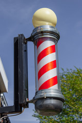 The barber's pole dates back to the middle ages and originally was a trade sign that also covered surgeons and dentists but modern signs only advertise a hair cut