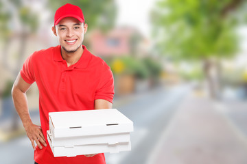 Pizza delivery latin man boy order delivering bringing deliver box young town copyspace copy space