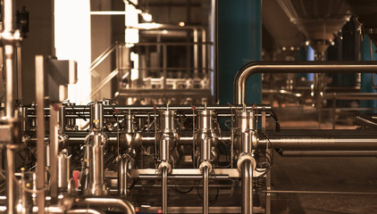 Stainless steel pipes in the factory. Construction on food production, Abstract industry background.