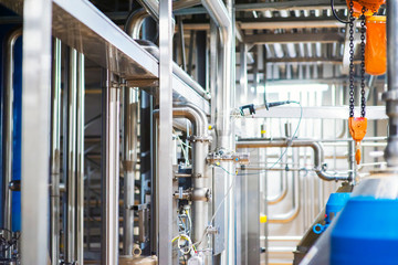 Stainless steel pipes in the factory. Construction on food production, Abstract industry background.