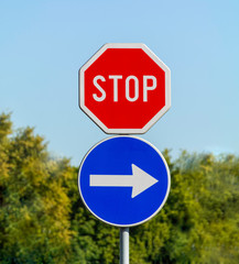 Stop and mandatory direction sign