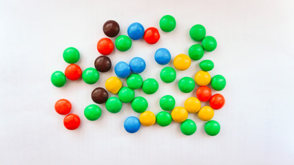 colorful chocolate buttons on a white background