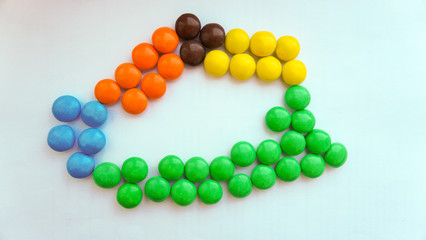 colorful chocolate buttons on a white background