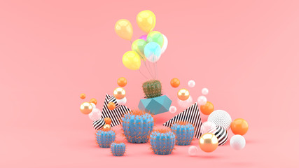 Cactus and balloons among colorful balls on a pink background.-3d rendering.