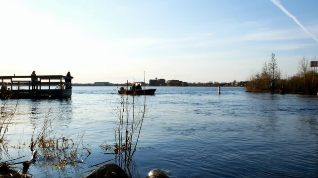 Minnesota Fishing Opener. People in boat and on shore of Lake Bemidji and the Mississippi River are hoping to catch their limit of walleye pike.