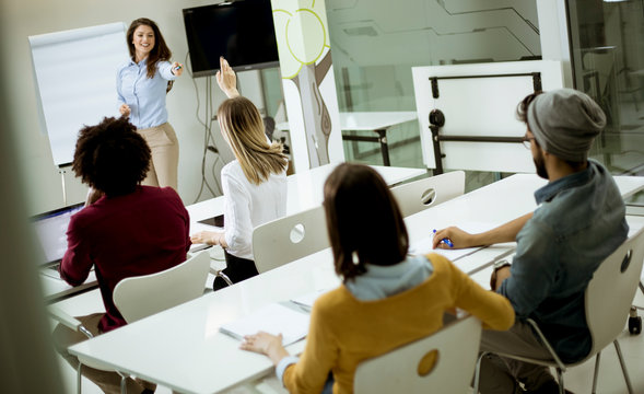Students rising hands to answer the question during the workshop training