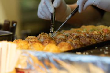 Takoyaki is a most famous Japanese snack food in Japan.