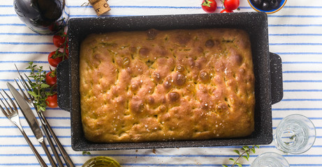 banner of Italian focaccia and grilled vegetables on a table with red wine and aromatic herbs. summer menu