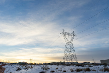pylons in field at sunrise