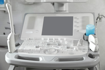 Modern ultrasound machine in clinic, space for text
