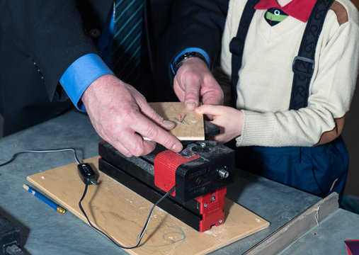 Children learn to make custom objects in fablab classes. Joiner's training on makerfaire.